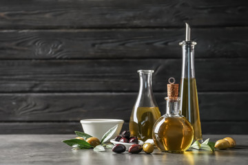 Obraz na płótnie Canvas Composition with fresh olive oil on table