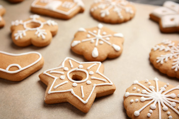 Tasty homemade Christmas cookies on parchment paper, closeup