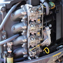 Four carburetors, intake manifold, fuel filter and cold start mechanism - four-stroke outboard...