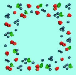 Blueberries and raspberries on a solid color background