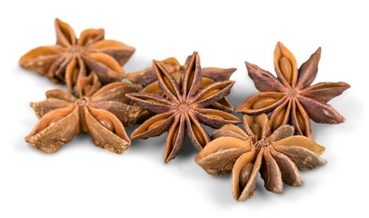 Several anise stars on white