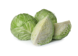 Fototapeta premium Whole and sliced cabbages on white background. Healthy food