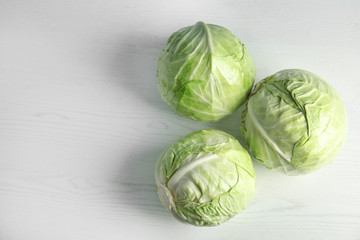 Fototapeta premium Whole cabbages on white table. Healthy food
