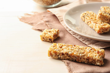 Homemade grain cereal bar on table, closeup. Healthy snack