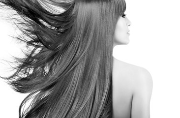 Beauty model with gorgeous long hair blowing to the side