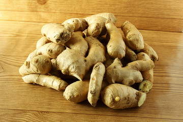 
Fresh ginger root isolated on wooden background