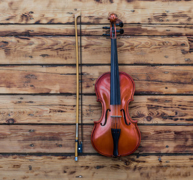 violin on an old wooden table