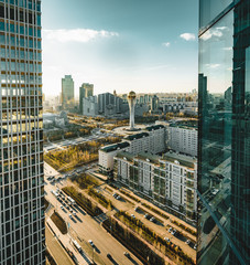Fototapeta premium Sunset view towards Bayterek tower and hous of ministries in Astana Kazakhstan on a clear day