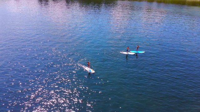Paddleboarding in the sparkling blue waters of Wisconsin.
