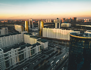 Sunset view towards Bayterek tower and hous of ministries in Astana Kazakhstan on a clear day