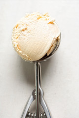 Salted caramel ice creams on ice cream scoop