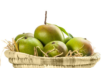 Mangoes in cane basket isolated on white background