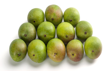 Raw Mangoes arranged on table top indoor