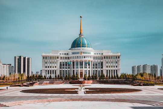 Presidential palace "Ak-Orda" with blue sky across river in Astana, Kazakhstan