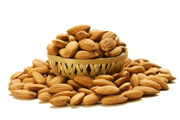 Almonds in Cane basket isolated on white background