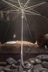 Close up shot of a antique 1950`s black umbrella, vintage concept.