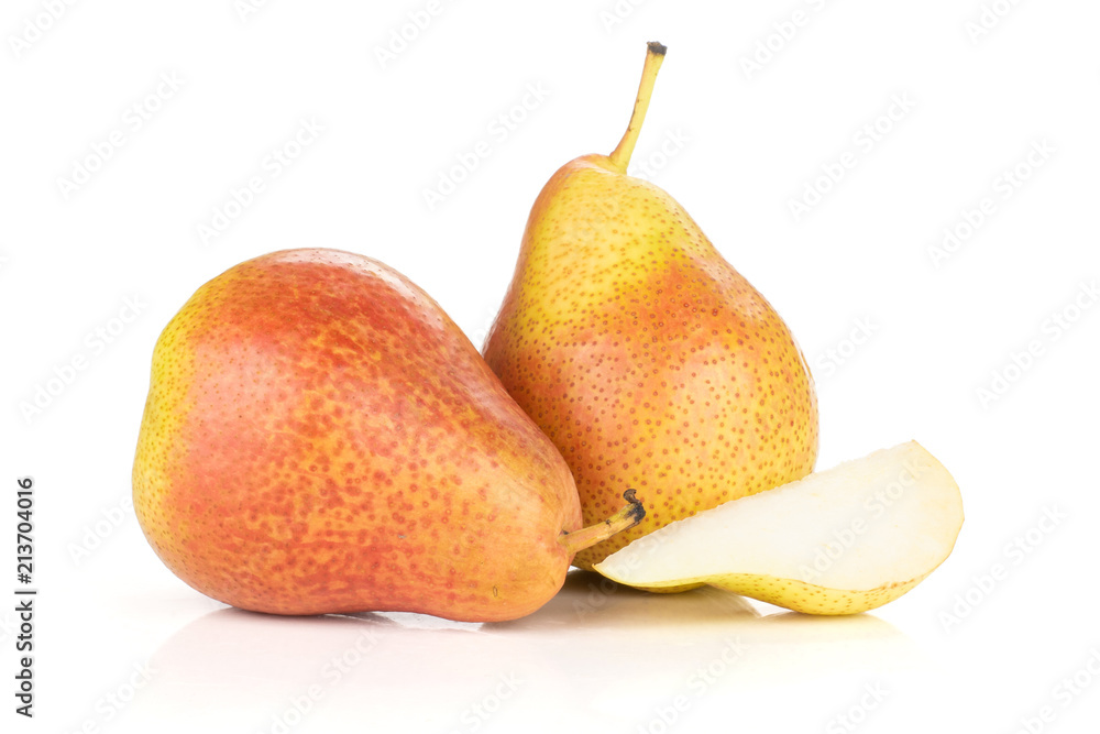 Wall mural group of two whole one slice of fresh red pear forelle variety isolated on white