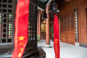 CHINA, SHANGHAI - NOVEMBER 5, 2017 : Shanghai old buddhist temple, Longhua Temple, traditional red ribbons with wishes.