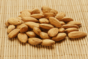 Almonds on wooden background
