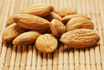 Almonds on wooden background