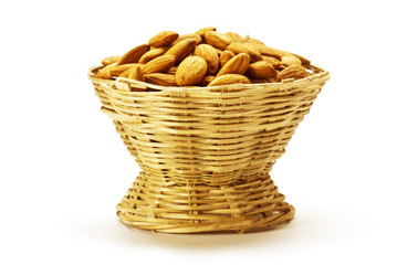 Almonds in Cane basket isolated on white background