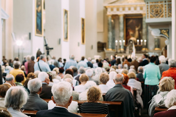 Group Of Old People Parishioners in Cathedral Church - obrazy, fototapety, plakaty