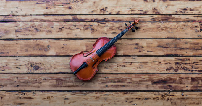violin on an old wooden table