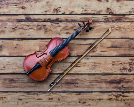 violin on an old wooden table