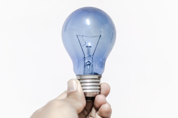 light bulb blue in hand white background