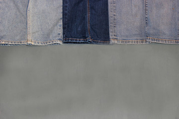Denim frame on  grey background, space for text