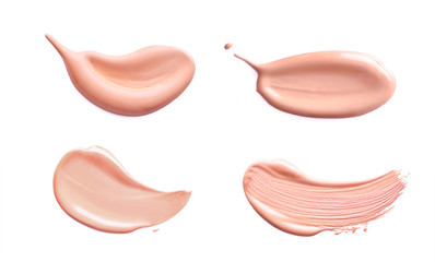 Makeup foundation cosmetic smear cream set isolated on white background. Light beige liquid...