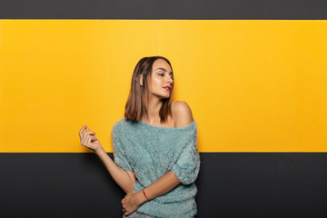 Pretty young lady fooling around in studio