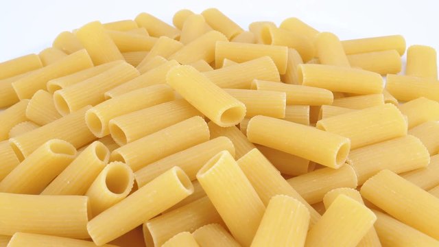 Macaroni pasta rotating an withe background (loopable)