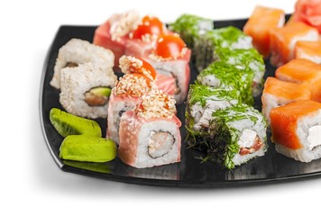 Maki-sushi on black plate