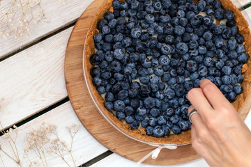 Delicious dessert blueberry tart with fresh berries, sweet tasty cheesecake, berry pie.