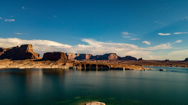 Aerial view of Lake Powell near Navajo Moutain, San Juan River in Glen Canyon with clear, beautiful skies, buttes, hills and water