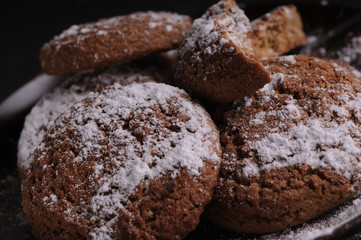 oatmeal cookies on a black table in castor sugar