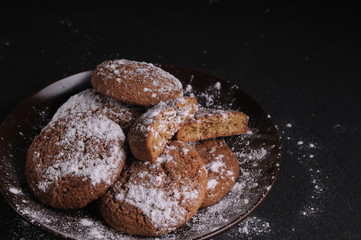 oatmeal cookies on a black table in castor sugar