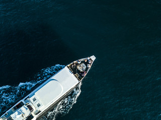 aerial top down view of travel ship nose part in the open sea