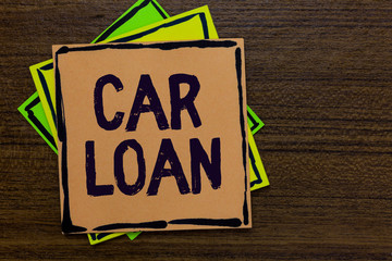 Word writing text Car Loan. Business concept for taking money from bank with big interest to buy new vehicle Paper notes Important reminders Express ideas messages Wooden background.