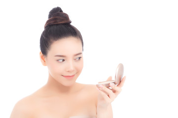 Obraz na płótnie Canvas Portrait of beautiful asian woman applying powder puff at cheek makeup of cosmetic, beauty of girl with face smile isolated on white background, wellness and healthcare concept.