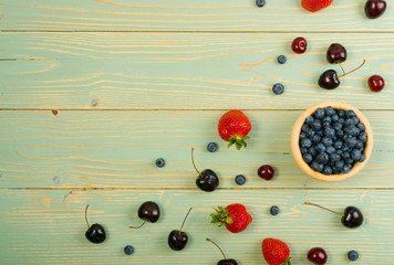Fresh Berries on Rustic Wooden Background
