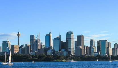 Fototapeta na wymiar Sydney city cbd buildings with harbour and boats in foreground, Australia