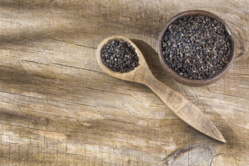 Black organic seeds of sesame - Sesamum indicum. Top view