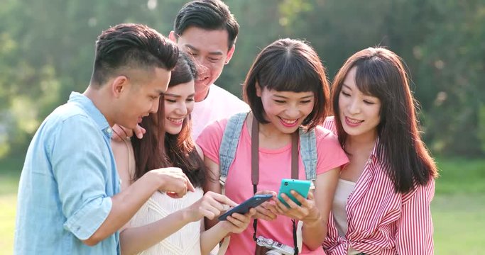 Friends go travel together and use of mobile phone