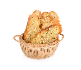 crunchy garlic bread in the basket on white background