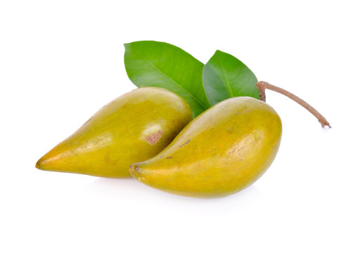 whole fresh canistel fruit with stem on white background