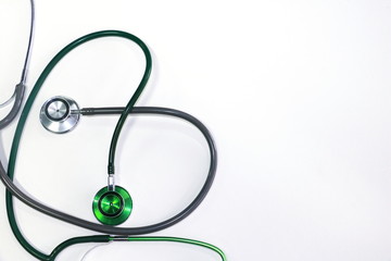 Green and silver stethoscope. Stethoscope check heart .Stethoscope show good health and caring...