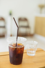 Cold brew coffee on the wooden table in the cafe.