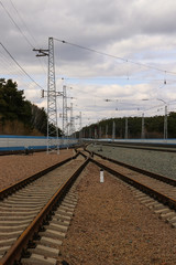 Overcast sky over railroad tracks leading into the distance